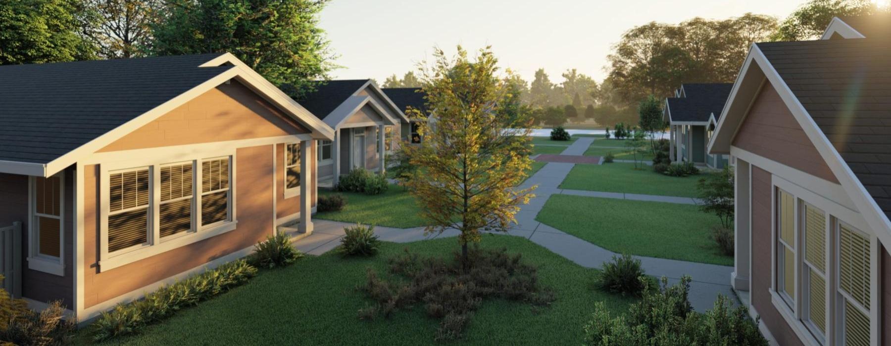 a group of houses with trees and grass